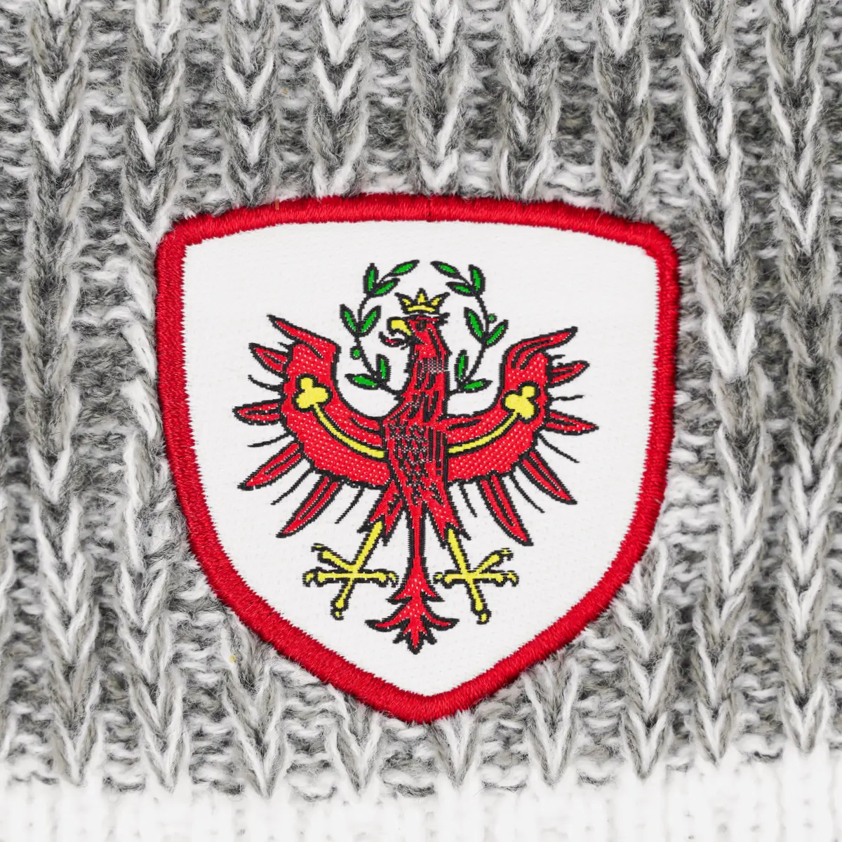 Kultbeanie Tirol Adler hellgrau